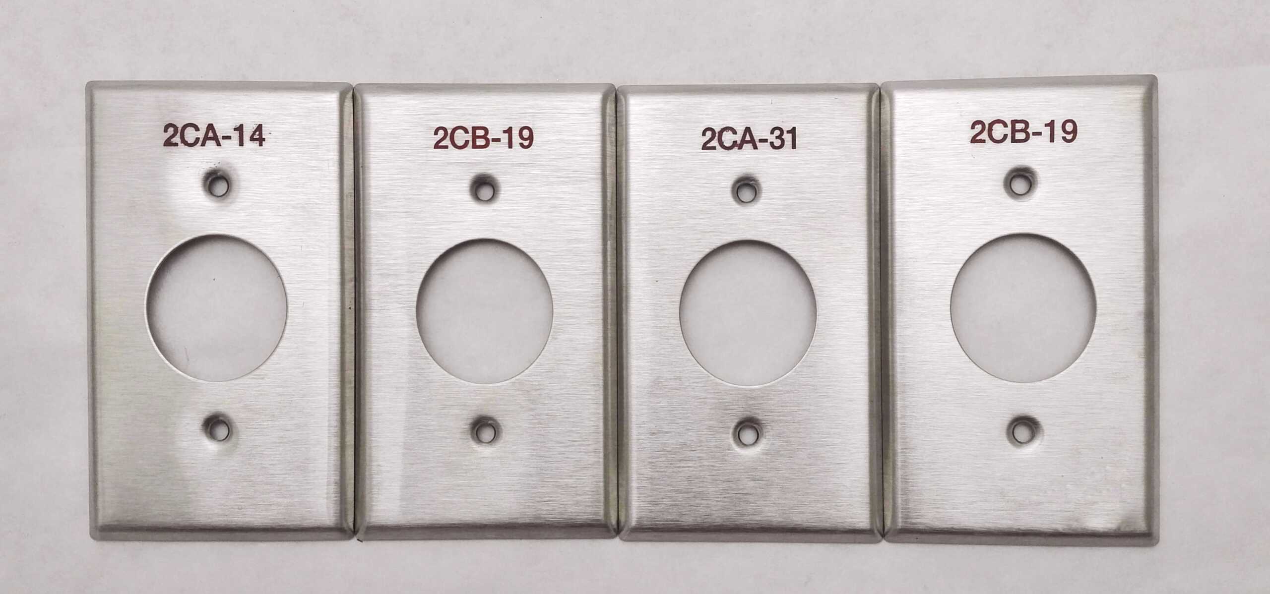 image of four custom engraved stainless steel paint-filled switch plate s with red paint-fill