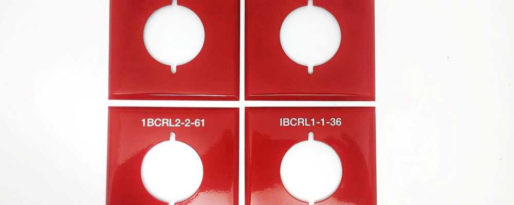 Custom Engraved Thermoplastic Nylon Red Legend Plates with White Paint-Fill- Image of Switchplates or Wall Cover Plates. Contractor, hospital, university, school, government offices, federal buildings